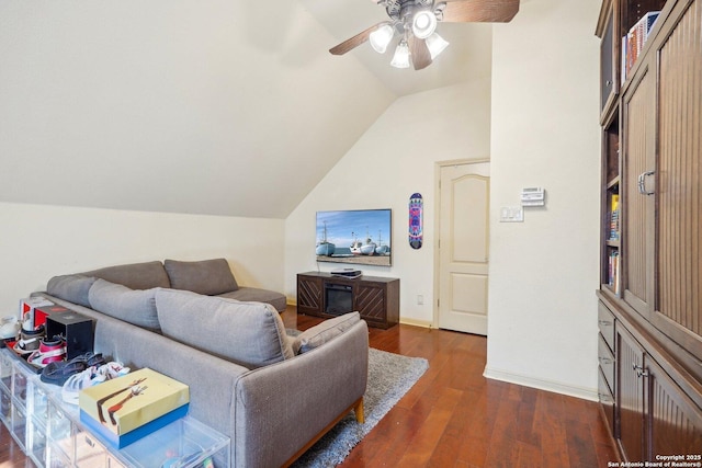 living room with dark hardwood / wood-style flooring, vaulted ceiling, and ceiling fan