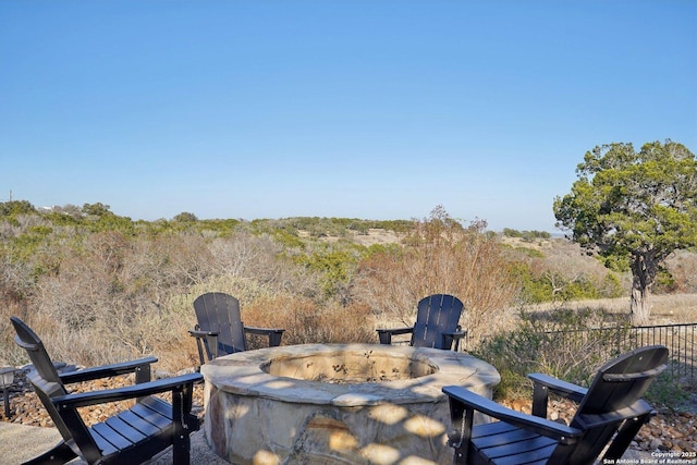 view of patio / terrace featuring an outdoor fire pit