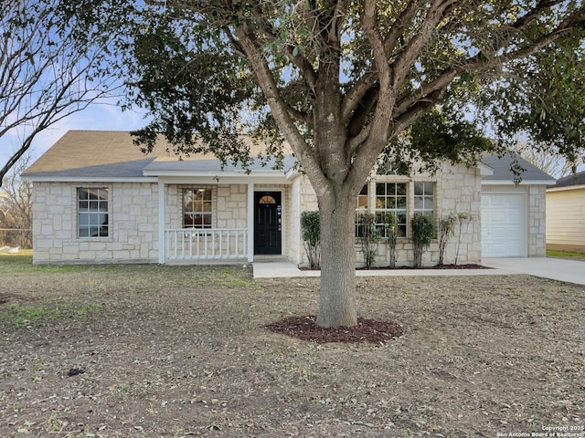 view of front of house with a porch and a garage