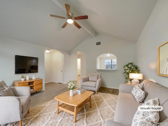 living room with lofted ceiling with beams, ceiling fan, and light hardwood / wood-style floors