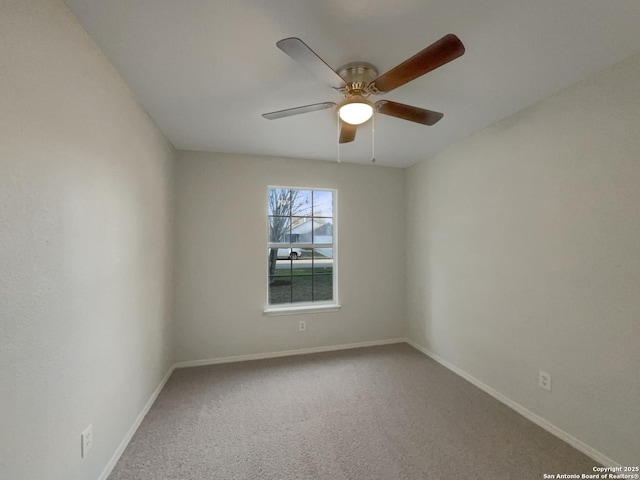 spare room featuring ceiling fan and carpet floors