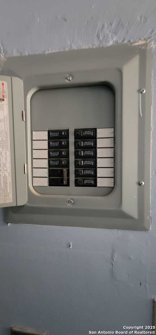 utility room featuring electric panel