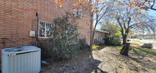 view of home's exterior with central AC unit