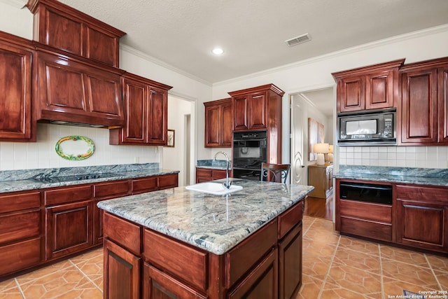 kitchen with a kitchen island, sink, ornamental molding, black appliances, and light stone countertops