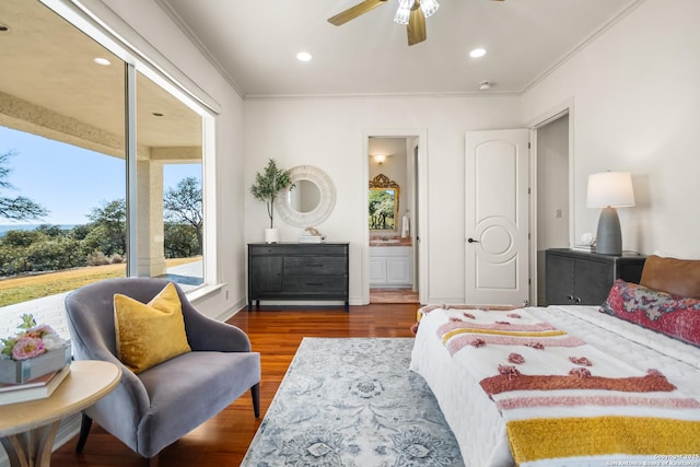 bedroom featuring ceiling fan, ensuite bath, ornamental molding, and hardwood / wood-style floors