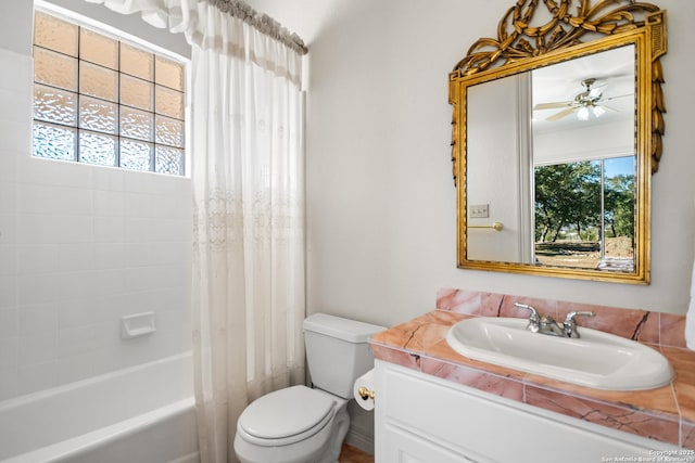 full bathroom featuring toilet, a healthy amount of sunlight, vanity, and shower / bath combo with shower curtain