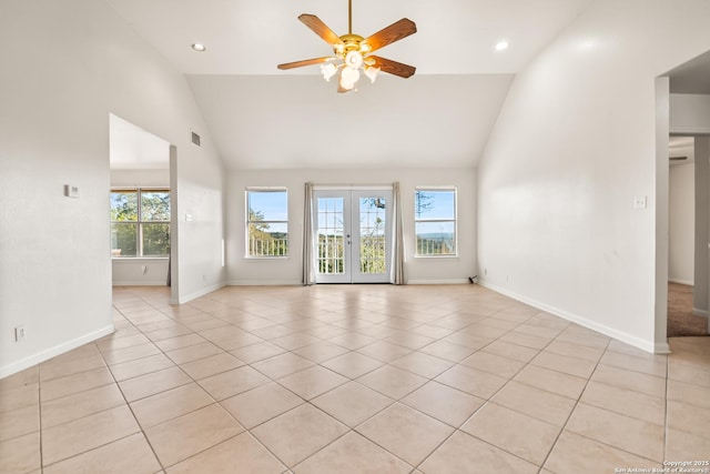 spare room featuring french doors, ceiling fan, light tile patterned flooring, and high vaulted ceiling