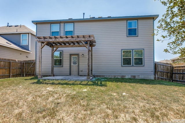 back of house with a patio, a lawn, and a pergola