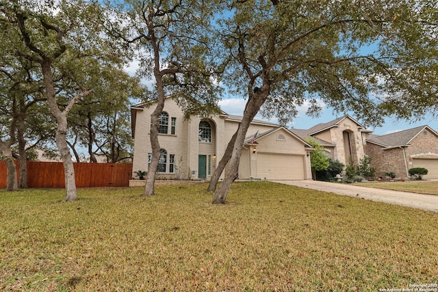 view of front facade featuring a garage and a front lawn