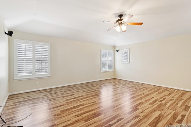 spare room with ceiling fan and light wood-type flooring