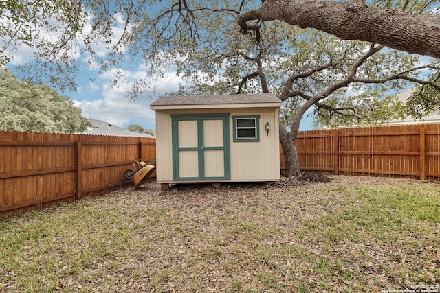 view of outbuilding with a lawn