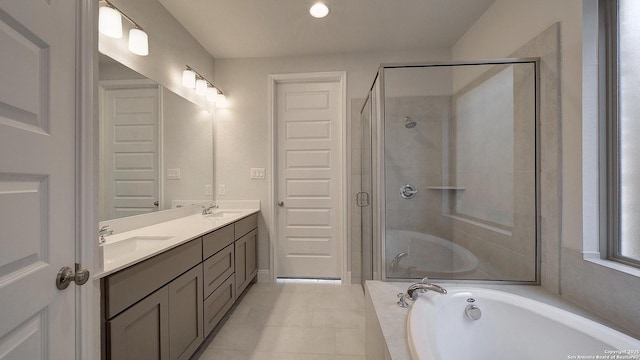 2606 Vistablue Ln, San Antonio, TX 78245 - bathroom featuring a shower stall, a garden tub, double vanity, and tile patterned flooring