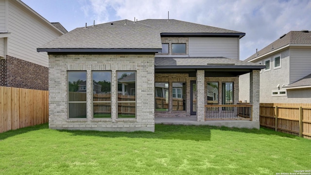 2606 Vistablue Ln, San Antonio, TX 78245 - rear view of house featuring brick siding, a shingled roof, and a patio