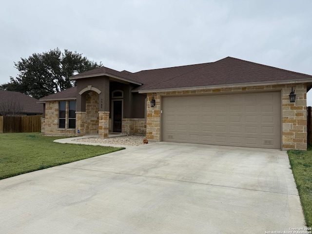 view of front of house featuring a garage and a front yard