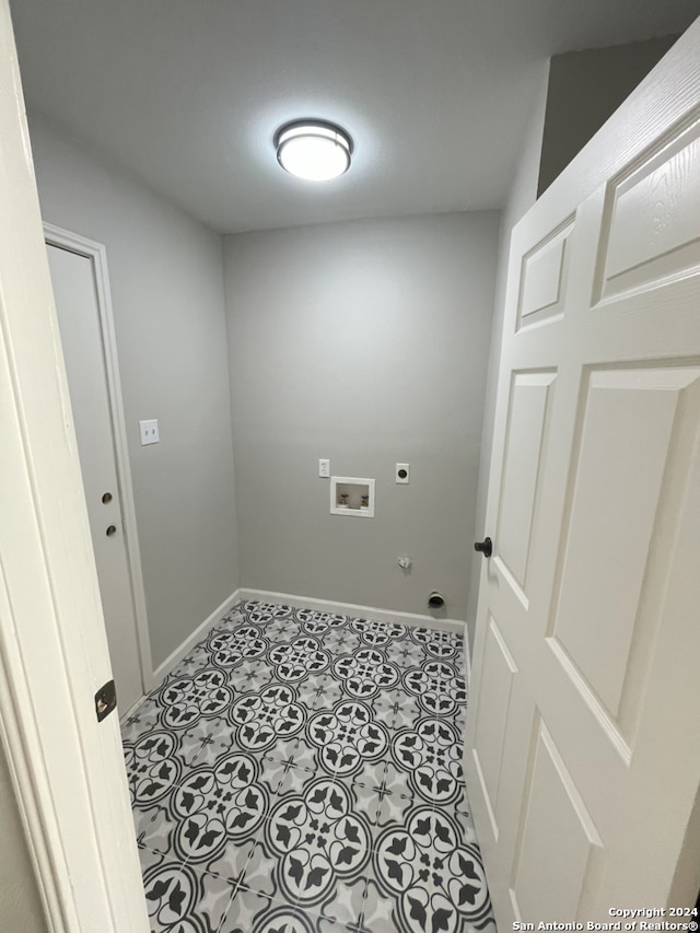 laundry room with hookup for a gas dryer, hookup for a washing machine, hookup for an electric dryer, and light tile patterned floors