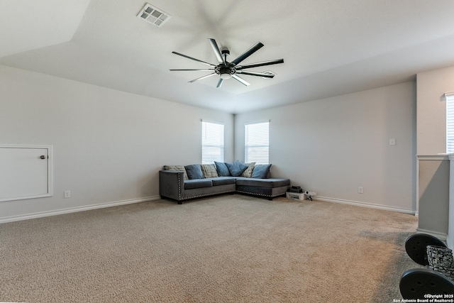 carpeted living room with ceiling fan