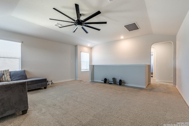 sitting room featuring ceiling fan, light colored carpet, and vaulted ceiling