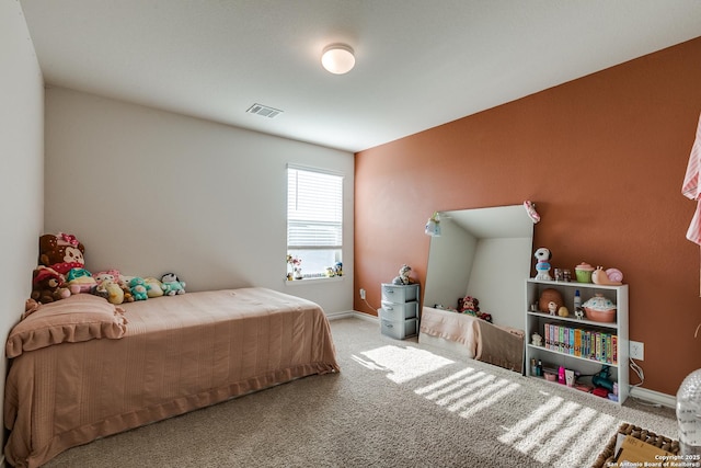 bedroom featuring light colored carpet