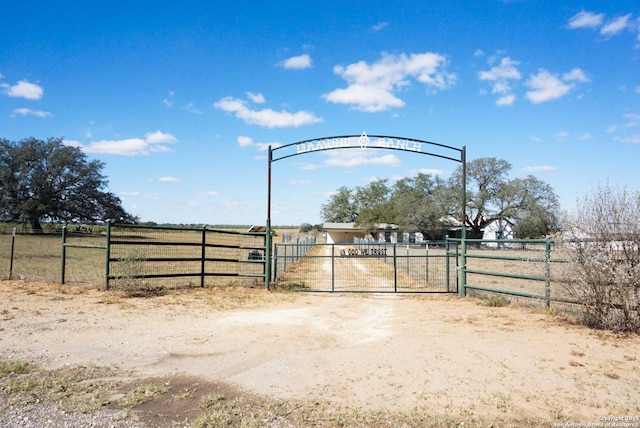 view of gate featuring a rural view