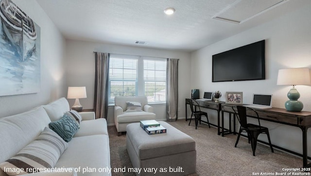 carpeted living room with a textured ceiling