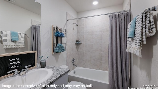 full bathroom featuring vanity, toilet, and shower / bath combo with shower curtain