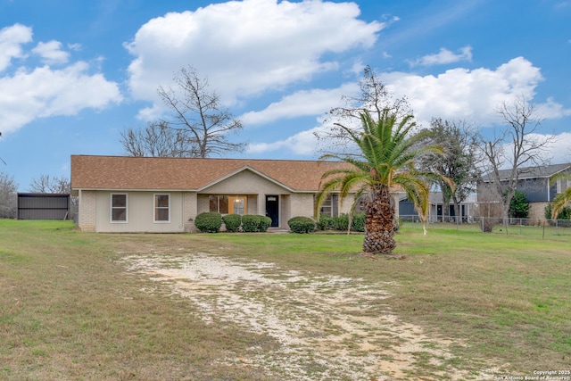 ranch-style home with a front yard