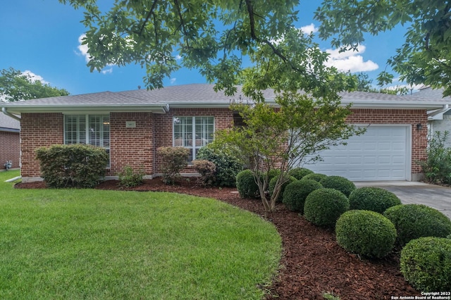 single story home with a garage and a front yard