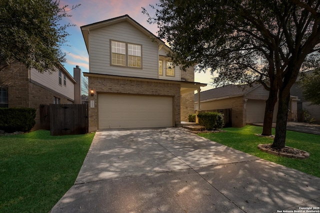 view of front property with a garage and a yard