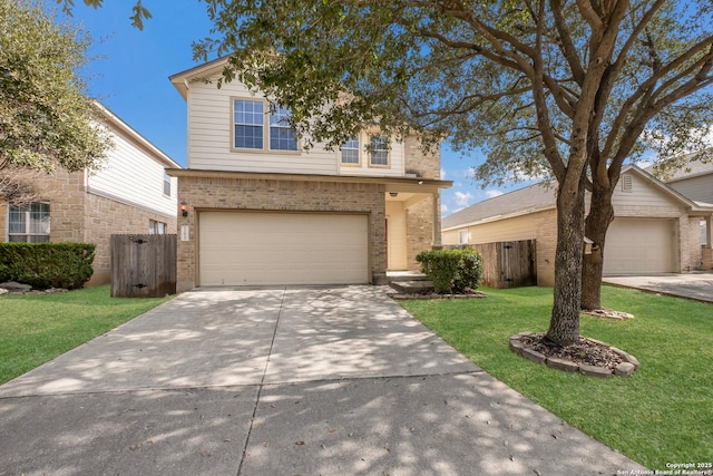 view of property featuring a garage and a front lawn