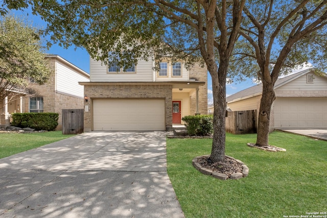 view of property with a garage and a front lawn