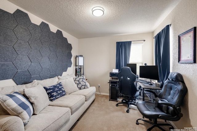 carpeted home office featuring a textured ceiling