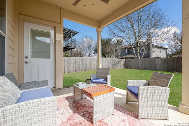 view of patio with outdoor lounge area and ceiling fan