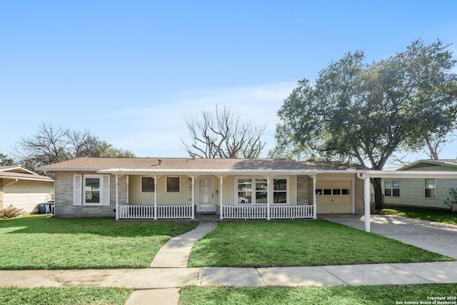 ranch-style home featuring a garage, a front yard, and covered porch