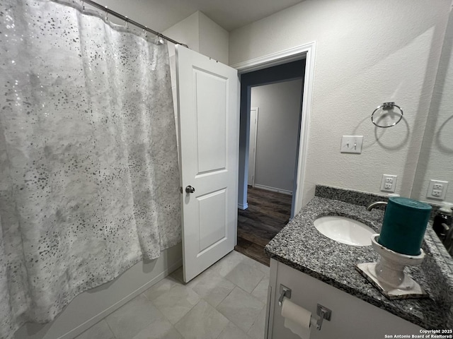 bathroom with shower / bath combo and vanity