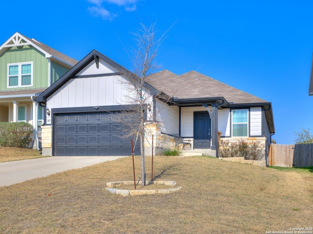 view of front of property with a garage and a front yard