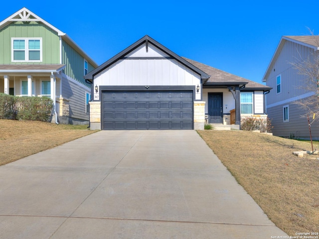 view of front facade with a garage and a front lawn