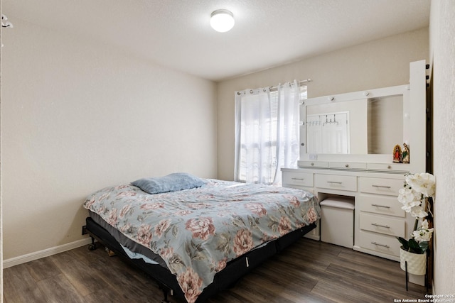 bedroom featuring dark hardwood / wood-style flooring