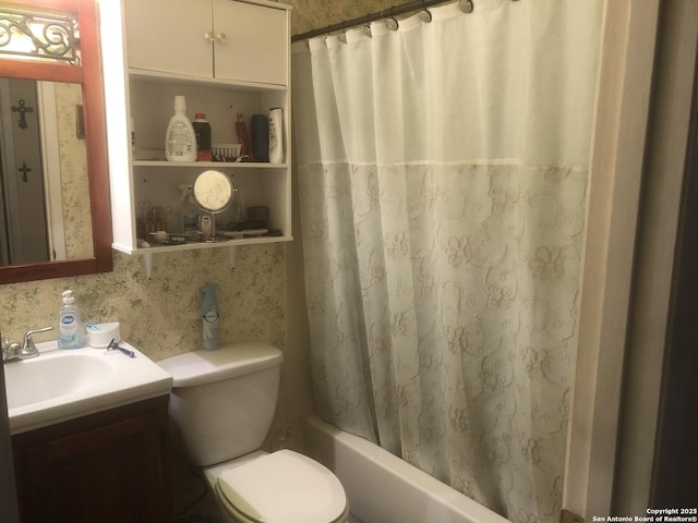 bathroom with shower / bath combo, vanity, toilet, and wallpapered walls