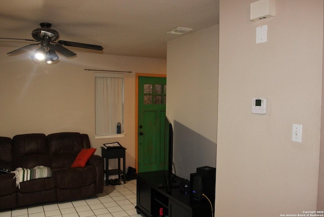 tiled living room featuring ceiling fan