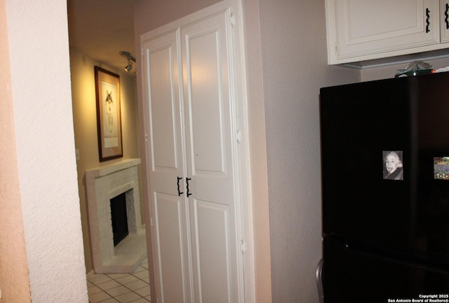 hallway with light tile patterned floors