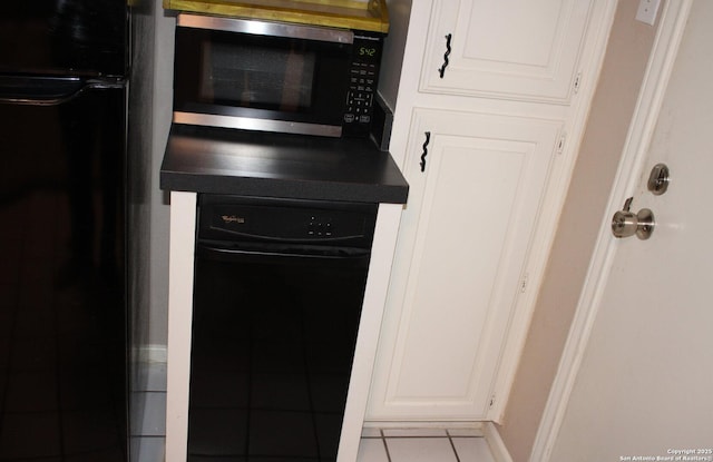 interior details featuring white cabinetry, dishwasher, and refrigerator