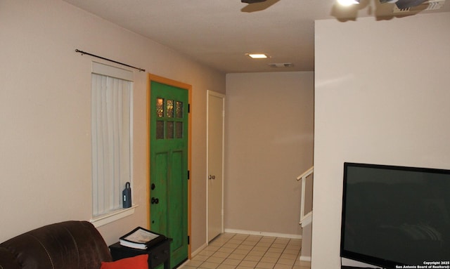 interior space featuring ceiling fan