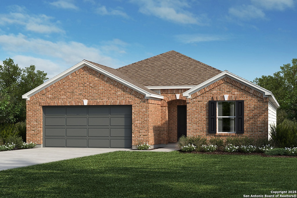 view of front of property featuring a garage and a front yard