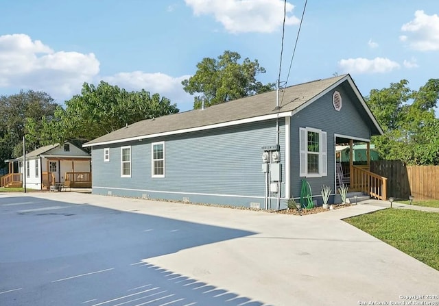 view of side of property with covered porch