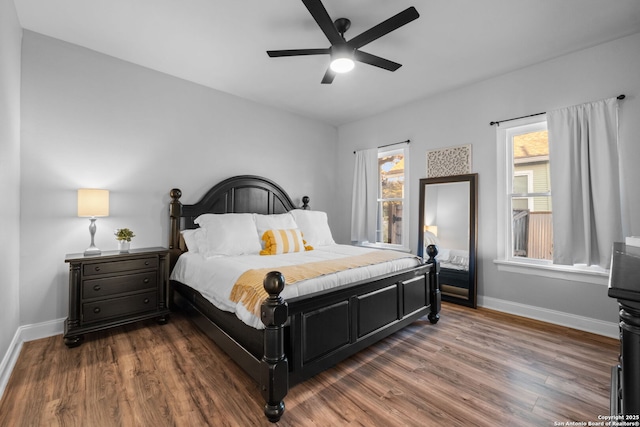 bedroom featuring dark hardwood / wood-style flooring and ceiling fan