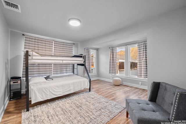 bedroom with hardwood / wood-style floors