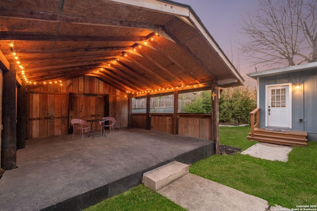 view of patio terrace at dusk