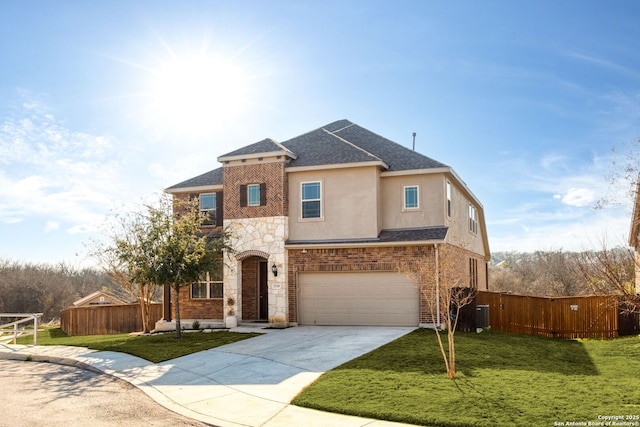 view of front facade with cooling unit, a garage, and a front lawn