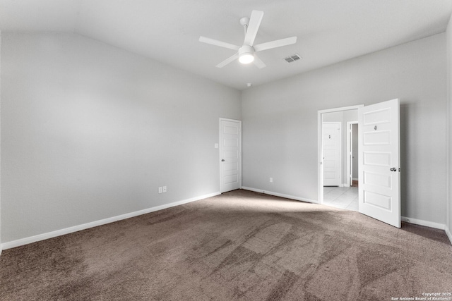 carpeted empty room with lofted ceiling and ceiling fan