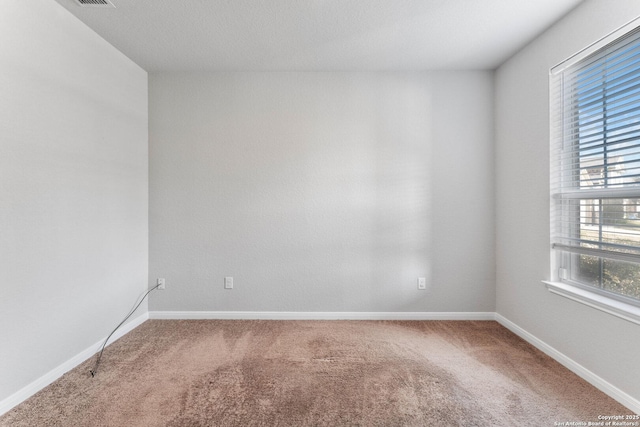 unfurnished room featuring carpet flooring